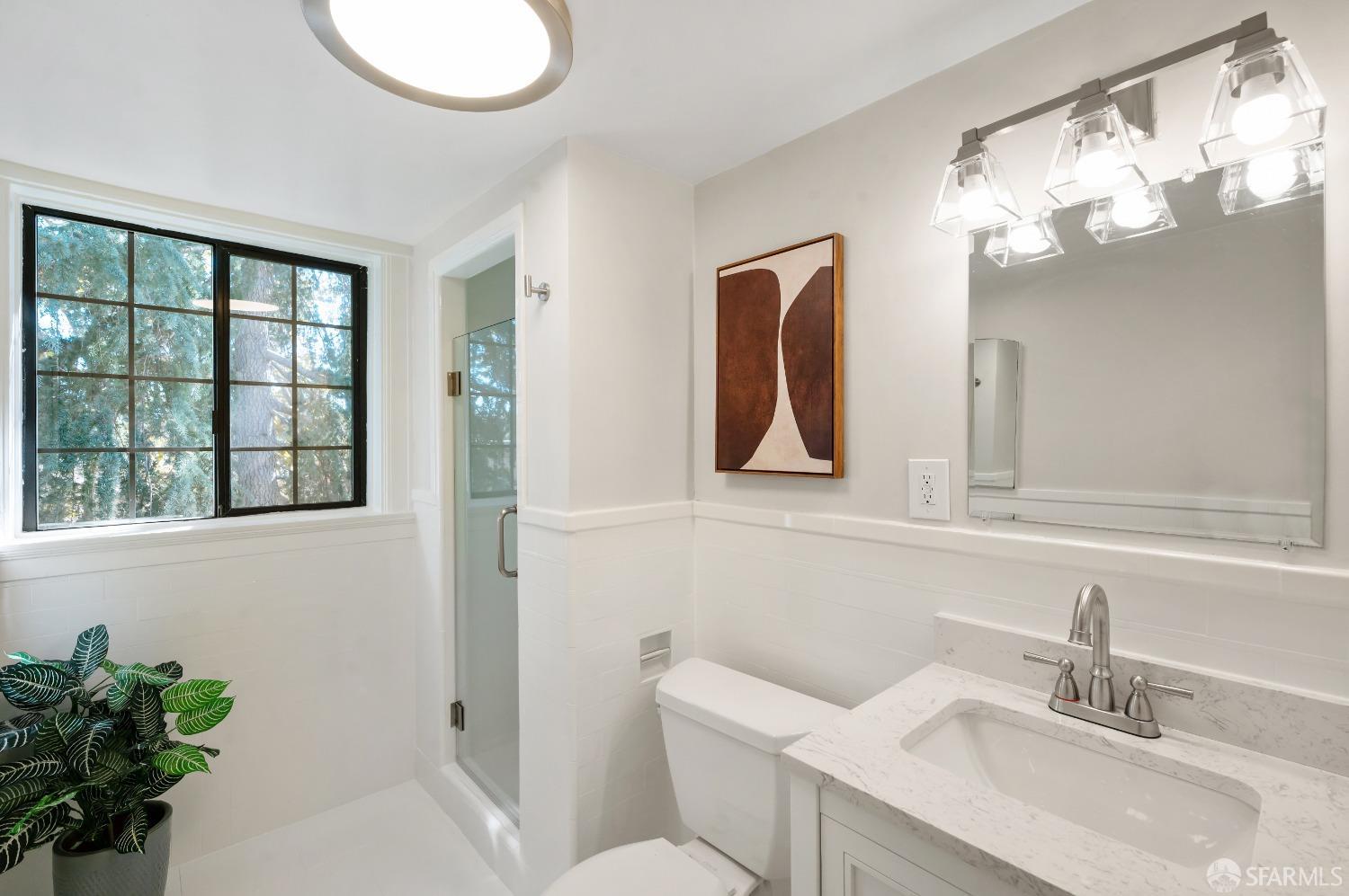 1616 Adeline Drive Burlingame, CA 94010 - Photo 33 of 67 a bathroom with a toilet sink and mirror