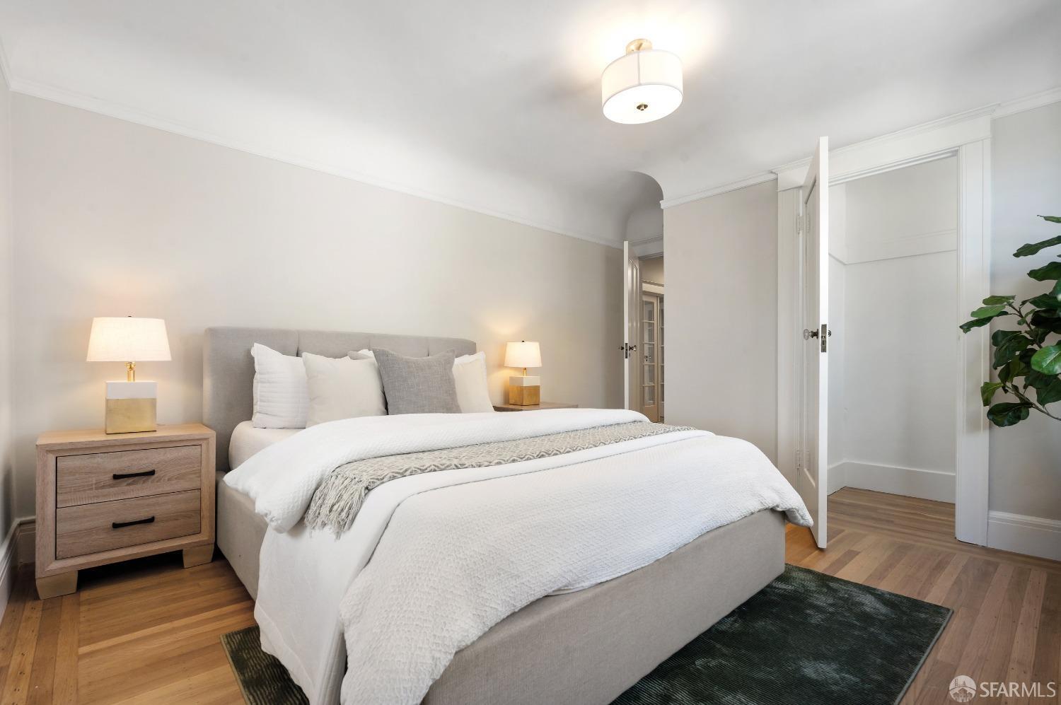 1616 Adeline Drive Burlingame, CA 94010 - Photo 41 of 67 a bedroom with a bed and a potted plant