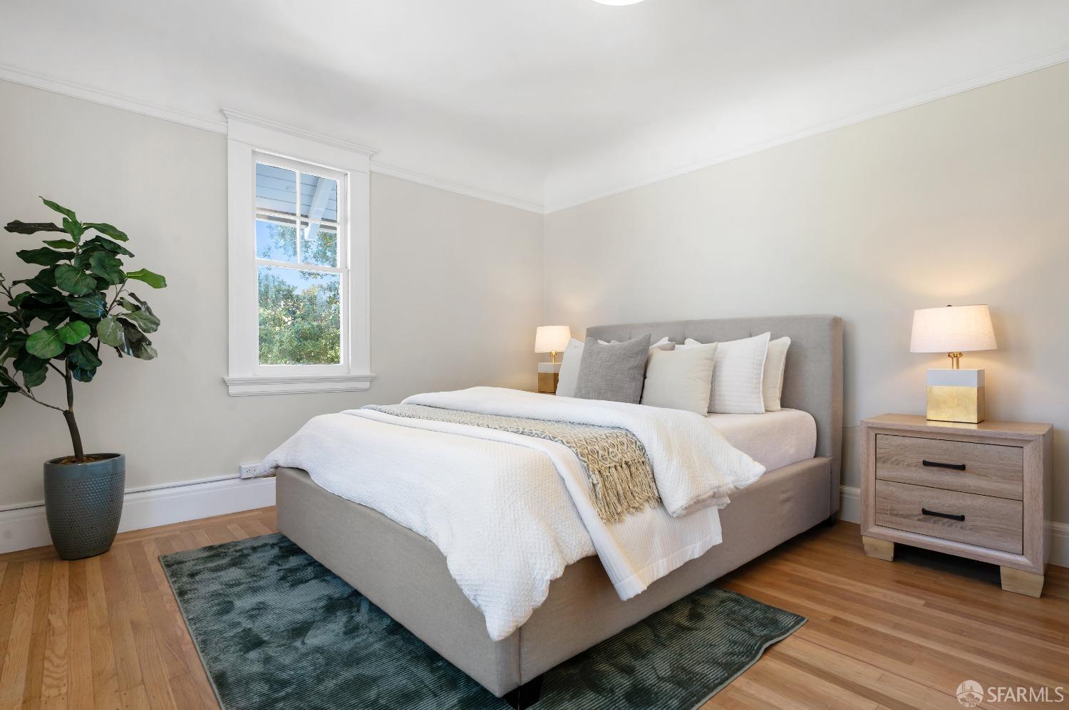 1616 Adeline Drive Burlingame, CA 94010 - Photo 42 of 67 a bedroom with a bed and a potted plant