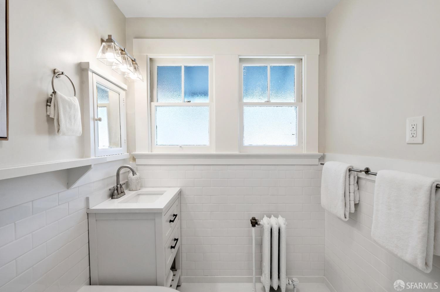 1616 Adeline Drive Burlingame, CA 94010 - Photo 45 of 67 a bathroom with a sink vanity and mirror