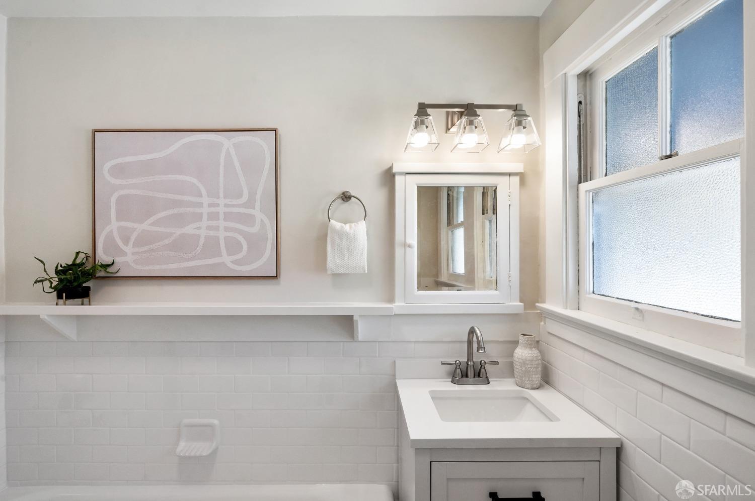 1616 Adeline Drive Burlingame, CA 94010 - Photo 46 of 67 a bathroom with a sink and a mirror