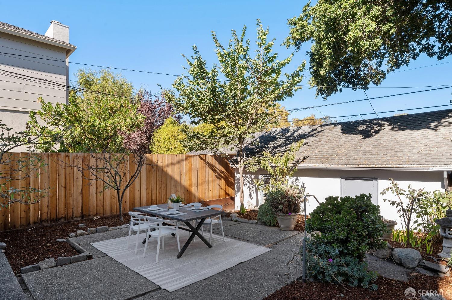 1616 Adeline Drive Burlingame, CA 94010 - Photo 54 of 67 a backyard of a house with table and chairs