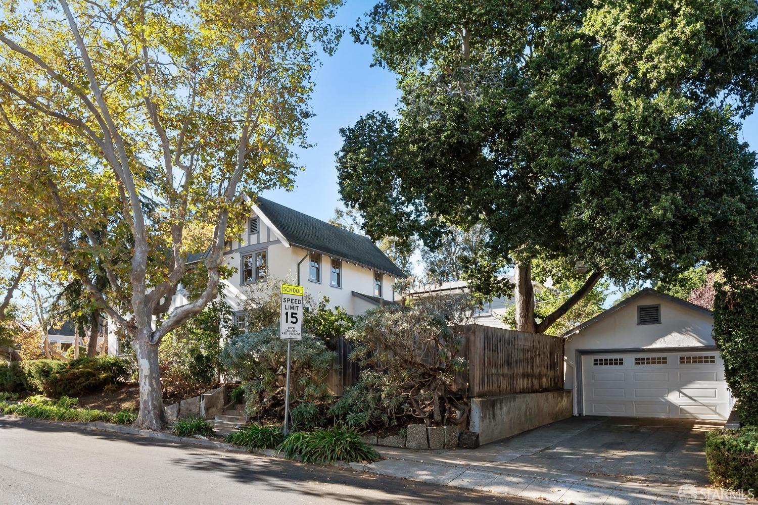 1616 Adeline Drive Burlingame, CA 94010 - Photo 65 of 67 a front view of a house with a tree
