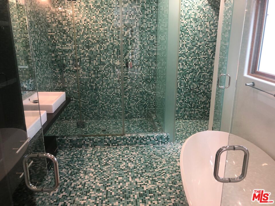 128 South Carson Road Beverly Hills, CA 90211 - Photo 15 of 20 a bathroom with a toilet and a sink