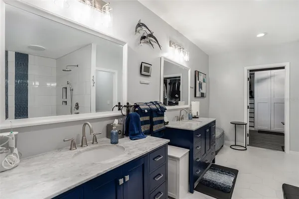 a white bath tub sitting next to a white toilet