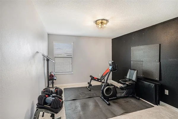a bathroom with a sink vanity mirror and toilet