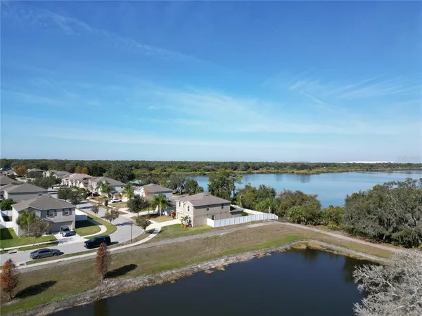 a aerial view of a house with a yard