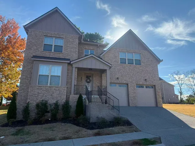 a front view of a house with yard