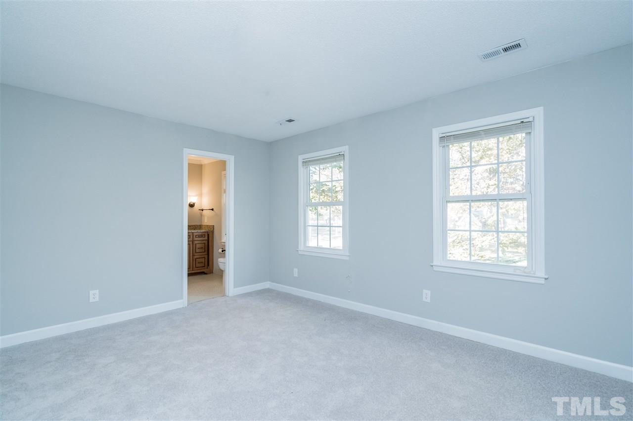 7212 St Ledger Drive Raleigh, NC 27613 - Photo 18 of 27 a view of an empty room with a window