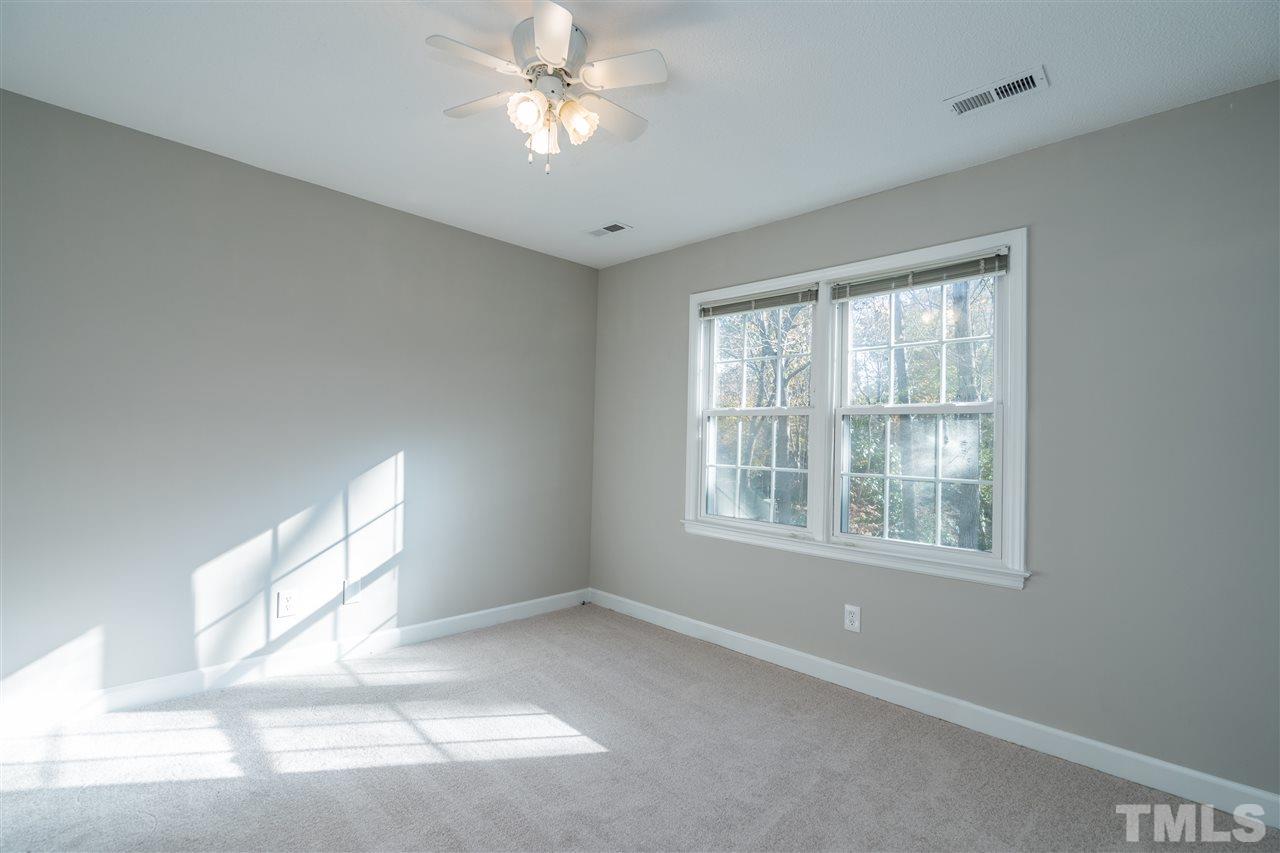 7212 St Ledger Drive Raleigh, NC 27613 - Photo 20 of 27 a view of an empty room with a window