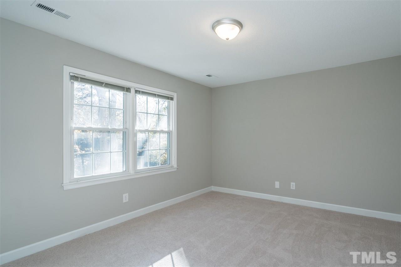 7212 St Ledger Drive Raleigh, NC 27613 - Photo 21 of 27 an empty room with a window