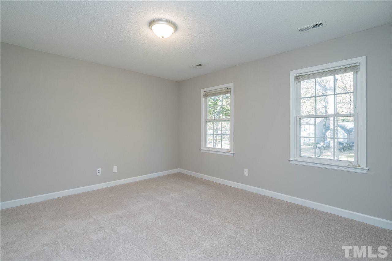 7212 St Ledger Drive Raleigh, NC 27613 - Photo 23 of 27 an empty room with windows