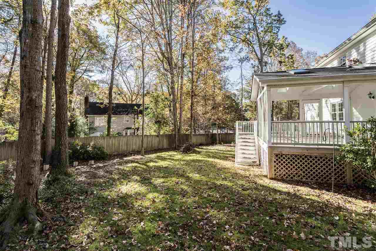 7212 St Ledger Drive Raleigh, NC 27613 - Photo 26 of 27 a backyard of a house with a tree