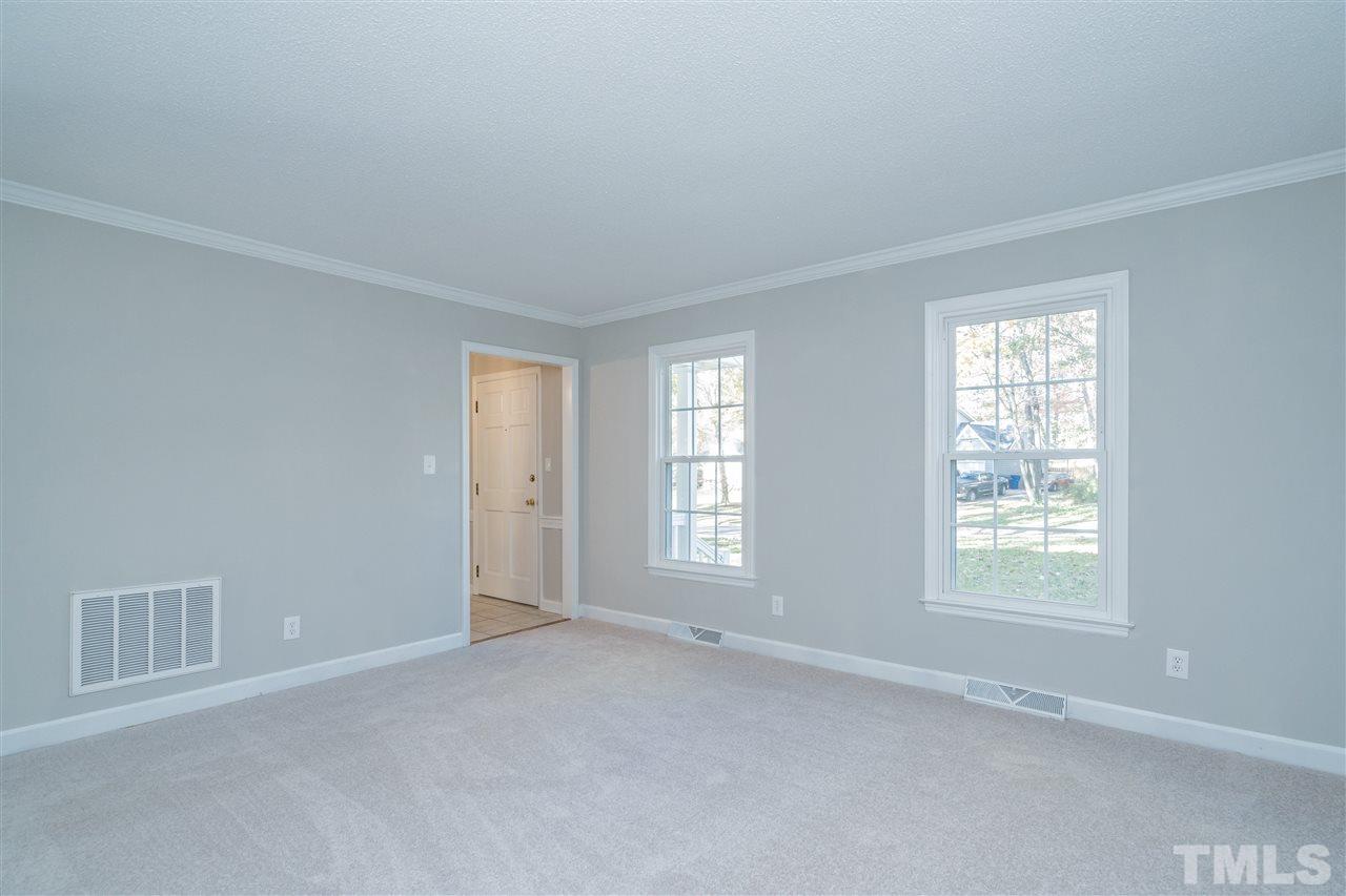 7212 St Ledger Drive Raleigh, NC 27613 - Photo 6 of 27 a view of an empty room with a window