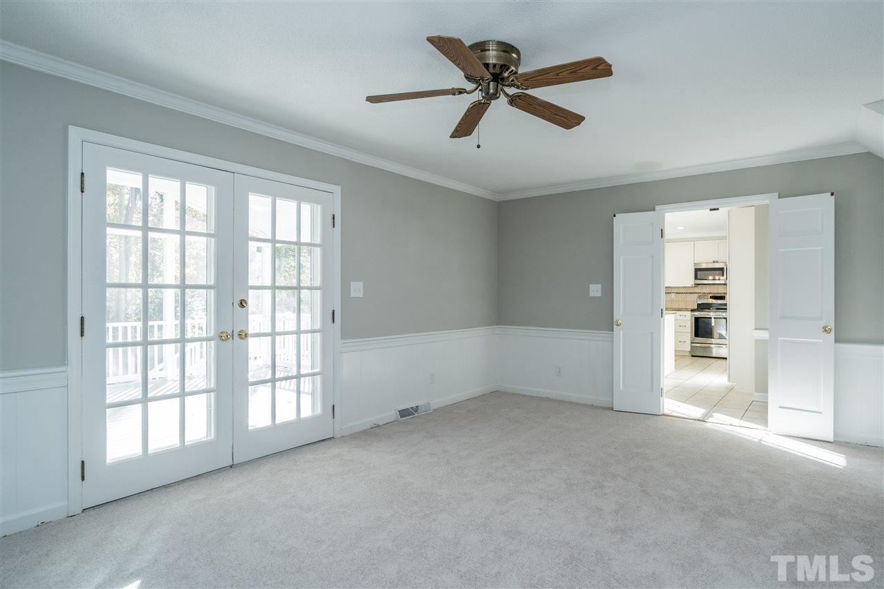 7212 St Ledger Drive Raleigh, NC 27613 - Photo 9 of 27 wooden floor in an empty room with a window