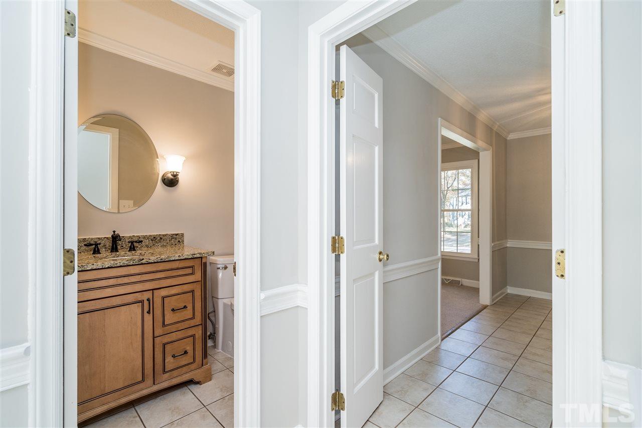 7212 St Ledger Drive Raleigh, NC 27613 - Photo 10 of 27 a kitchen with cabinets and stove