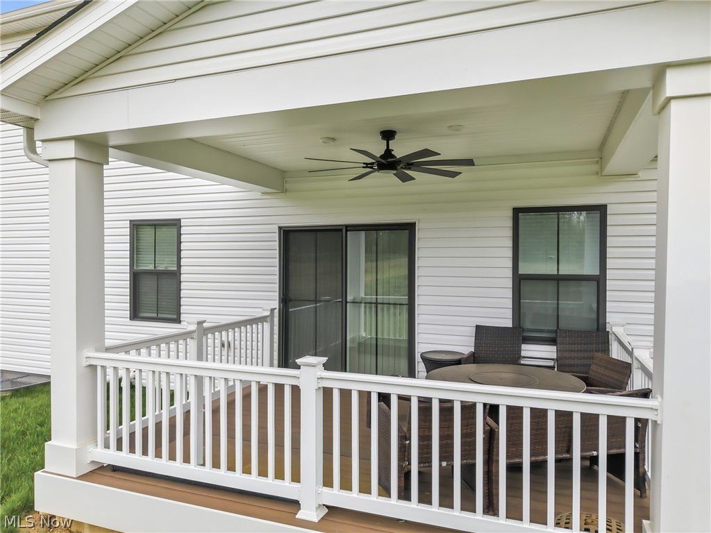 5358 Walnut Rdg Lane Sheffield Lake, OH 44054 - Photo 46 of 50 Covered outdoor deck featuring a ceiling fan, white railing, and wood-finish flooring