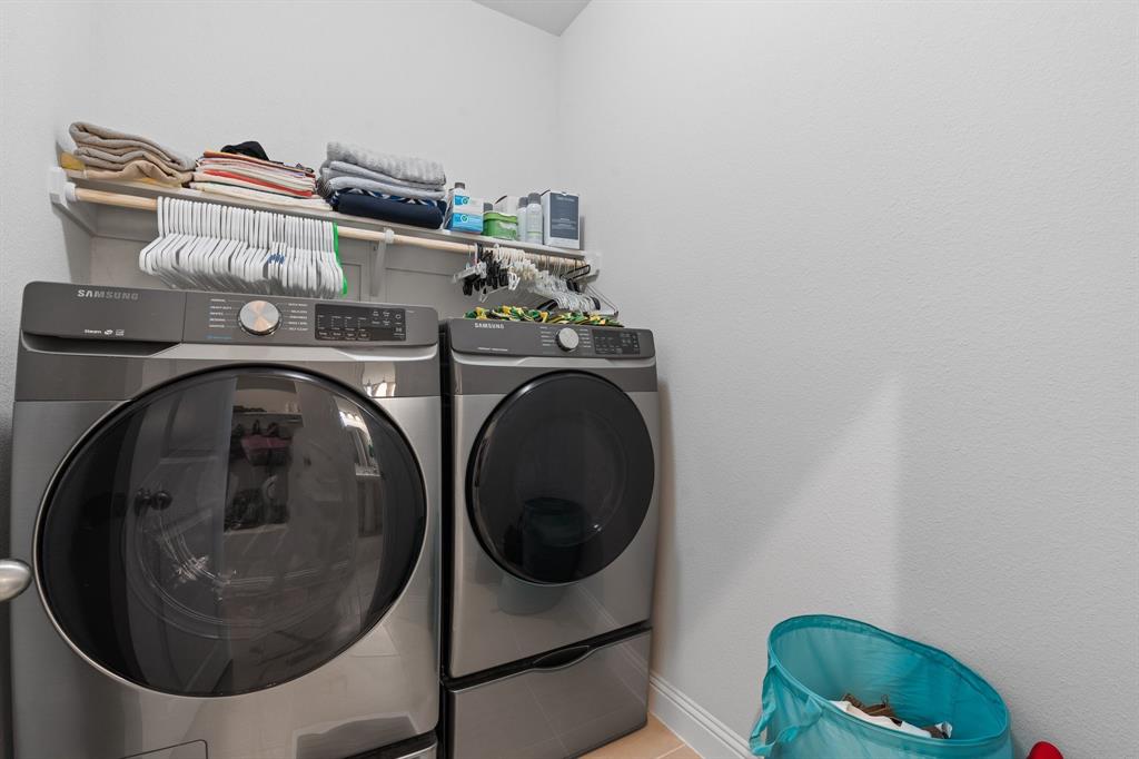 15105 Fleet Hill Road Aledo, TX 76008 - Photo 15 of 31 a utility room with dryer and washer