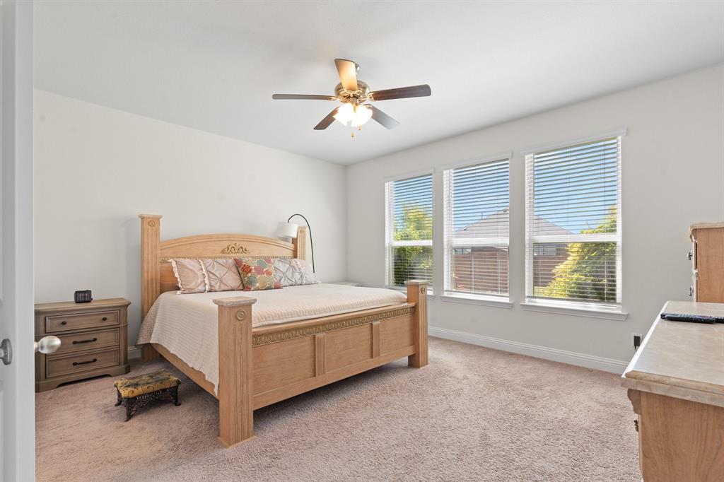 15105 Fleet Hill Road Aledo, TX 76008 - Photo 16 of 31 a bedroom with a bed and a large window
