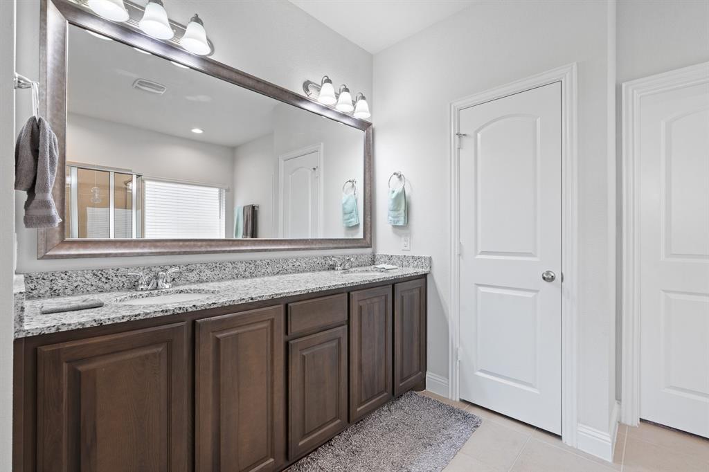 15105 Fleet Hill Road Aledo, TX 76008 - Photo 20 of 31 a bathroom with a granite countertop sink and a mirror