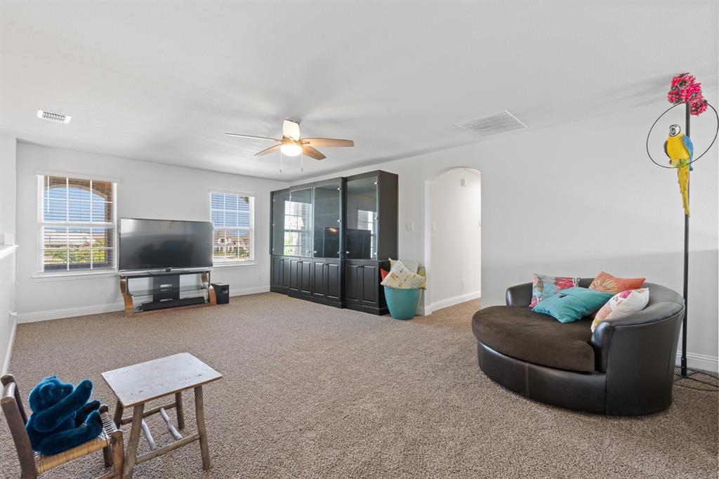 15105 Fleet Hill Road Aledo, TX 76008 - Photo 21 of 31 a living room with furniture and a flat screen tv
