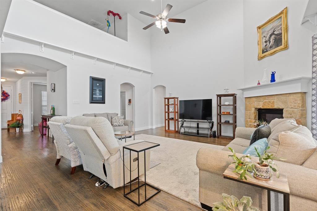 15105 Fleet Hill Road Aledo, TX 76008 - Photo 7 of 31 a living room with furniture and a flat screen tv