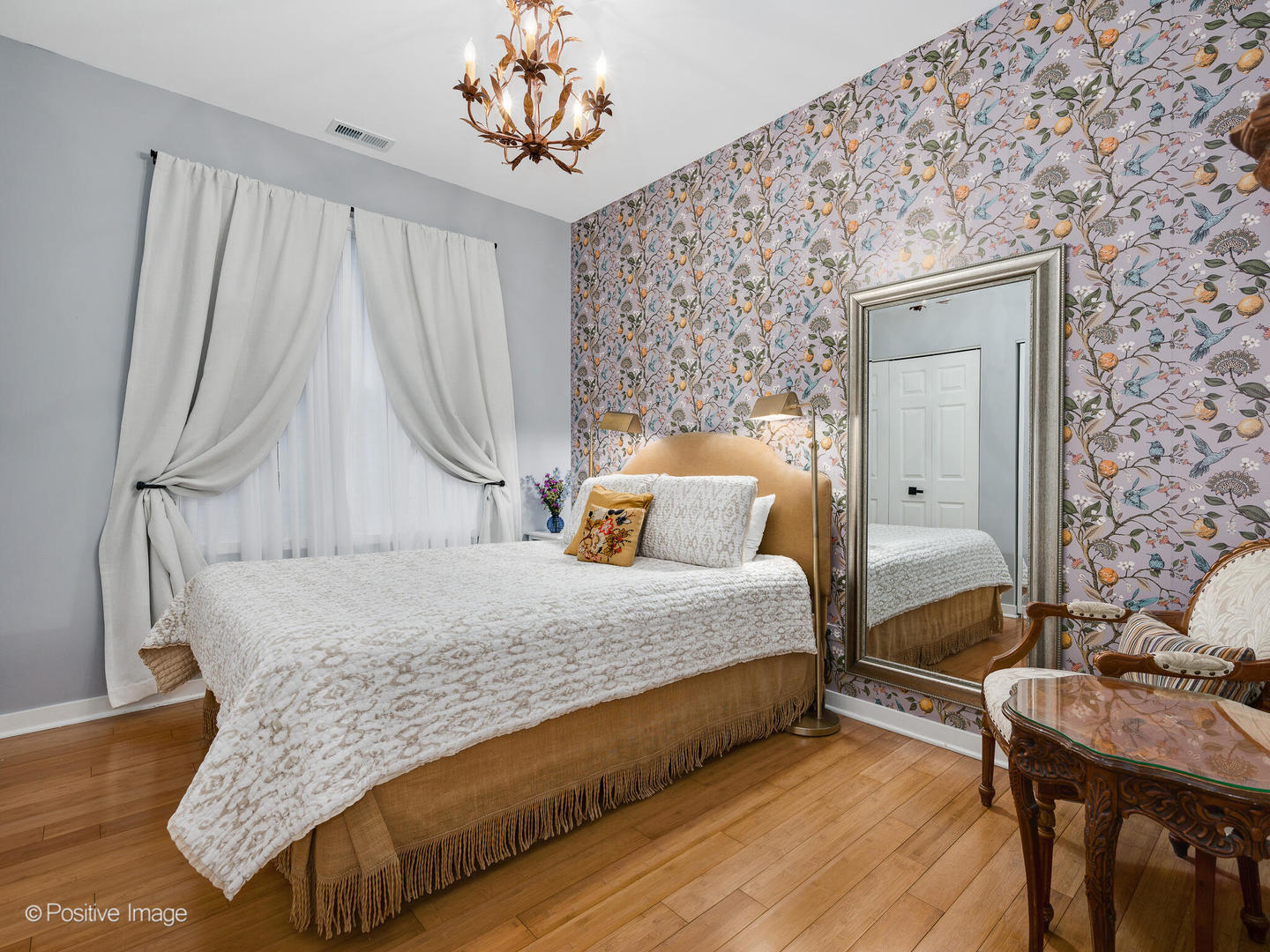 1349 West Fillmore Street, Unit B Chicago, IL 60607 - Photo 13 of 19 a bedroom with a bed and a chandelier