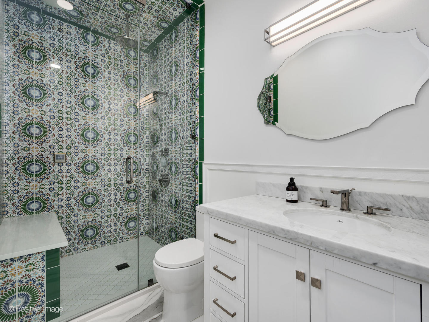 1349 West Fillmore Street, Unit B Chicago, IL 60607 - Photo 14 of 19 a bathroom with a sink a toilet and shower