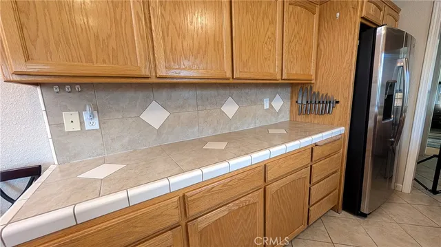 a bedroom with a bed and a mirror