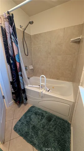a view of a chairs and table in backyard of the house
