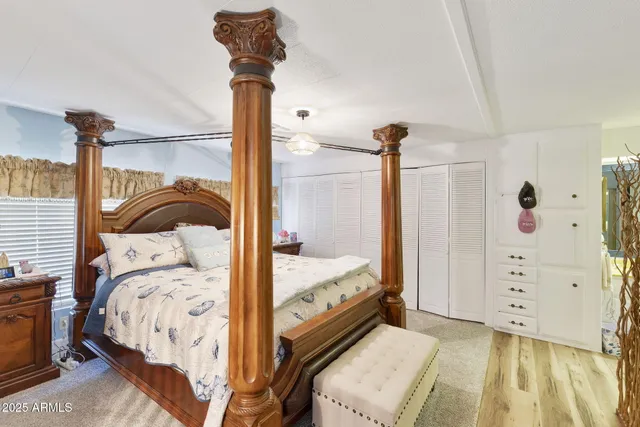 a bedroom with a bed and a dresser