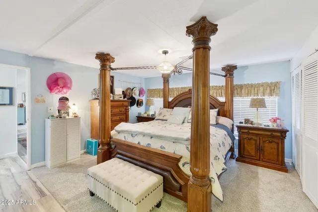 a bed room with a bed and a chandelier