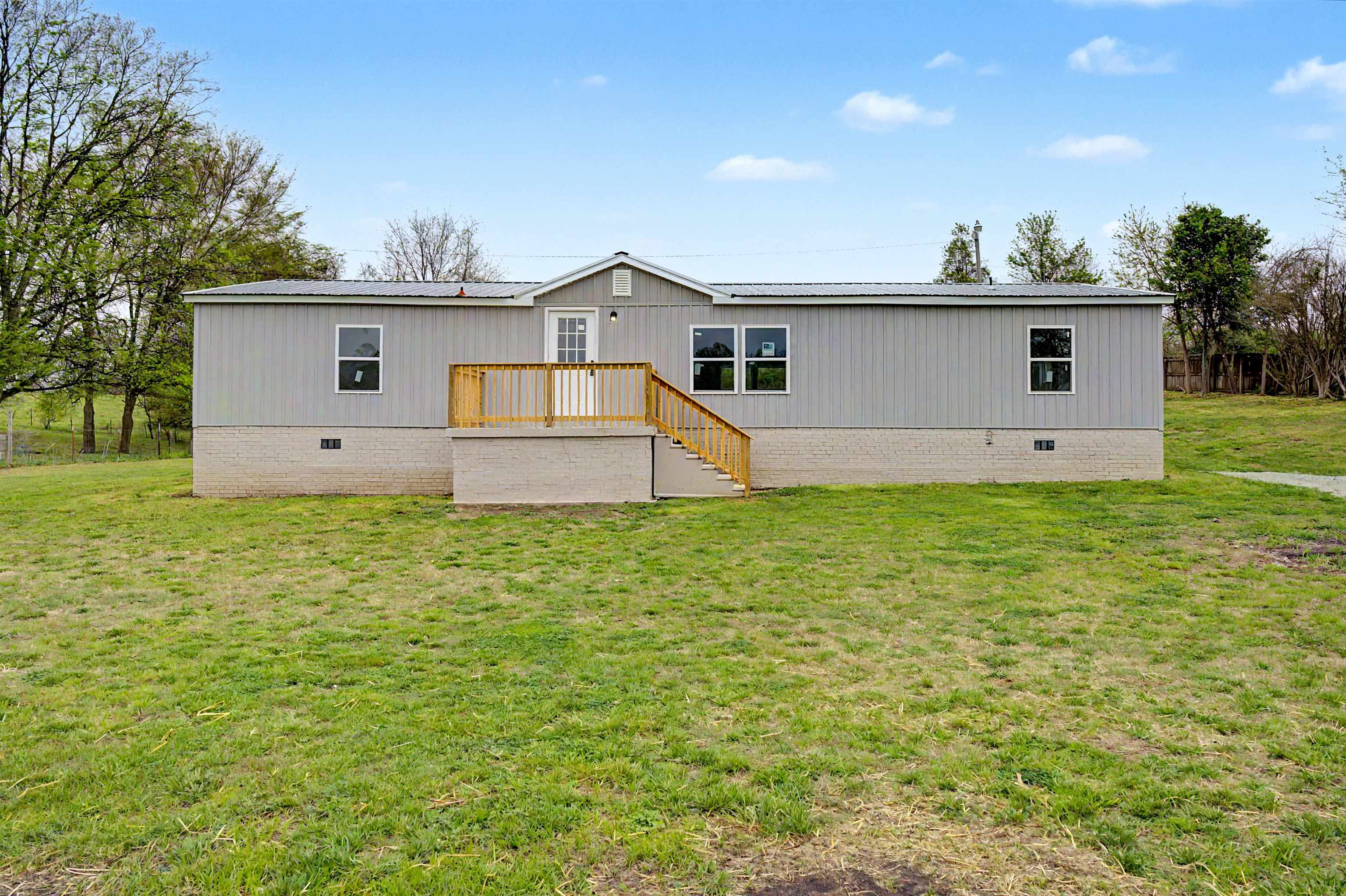 1090 Scott Road Newbern, TN 38059 - Photo 1 of 16 View of front of home with crawl space and a front yard