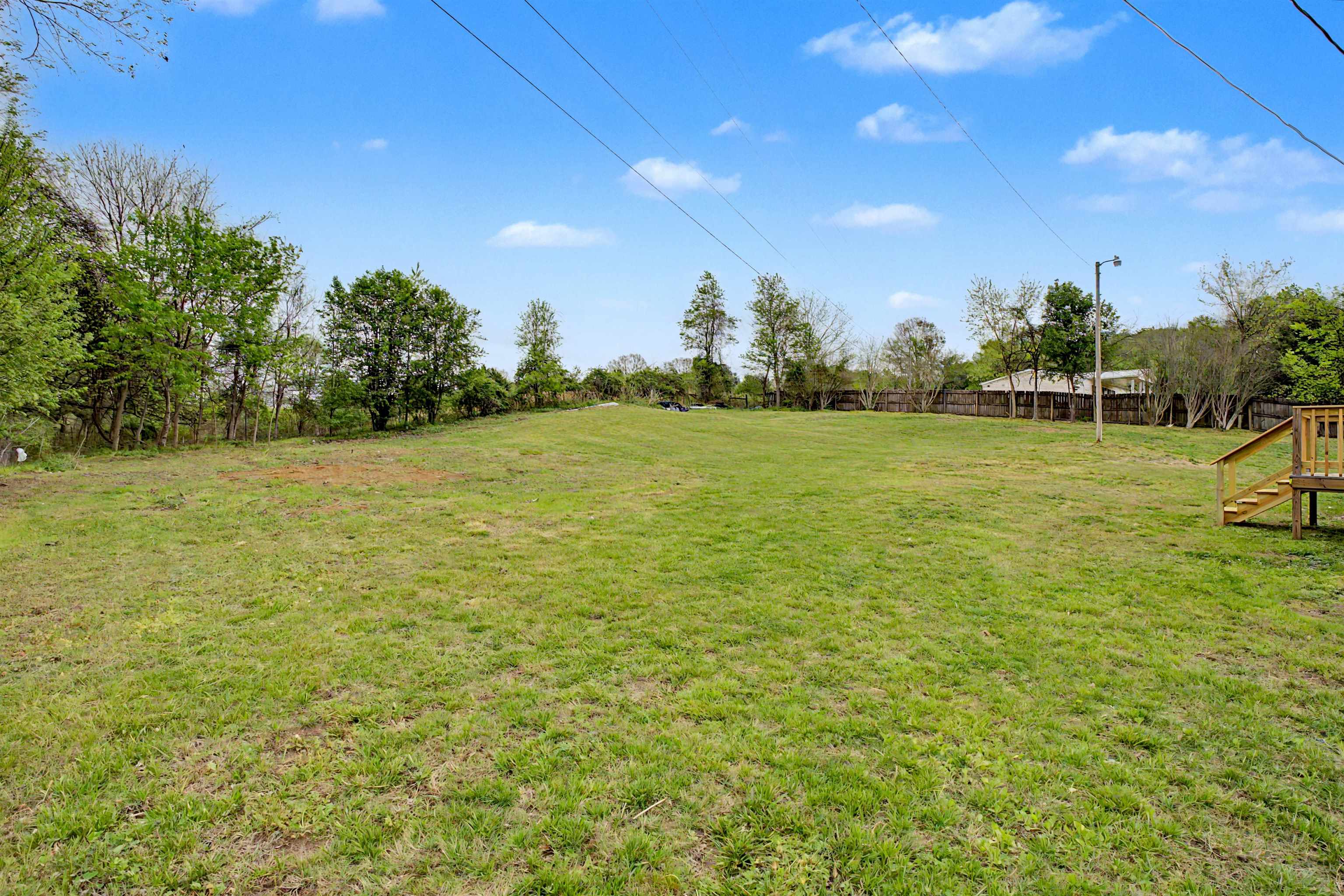 1090 Scott Road Newbern, TN 38059 - Photo 15 of 16 View of yard featuring view of wooded area
