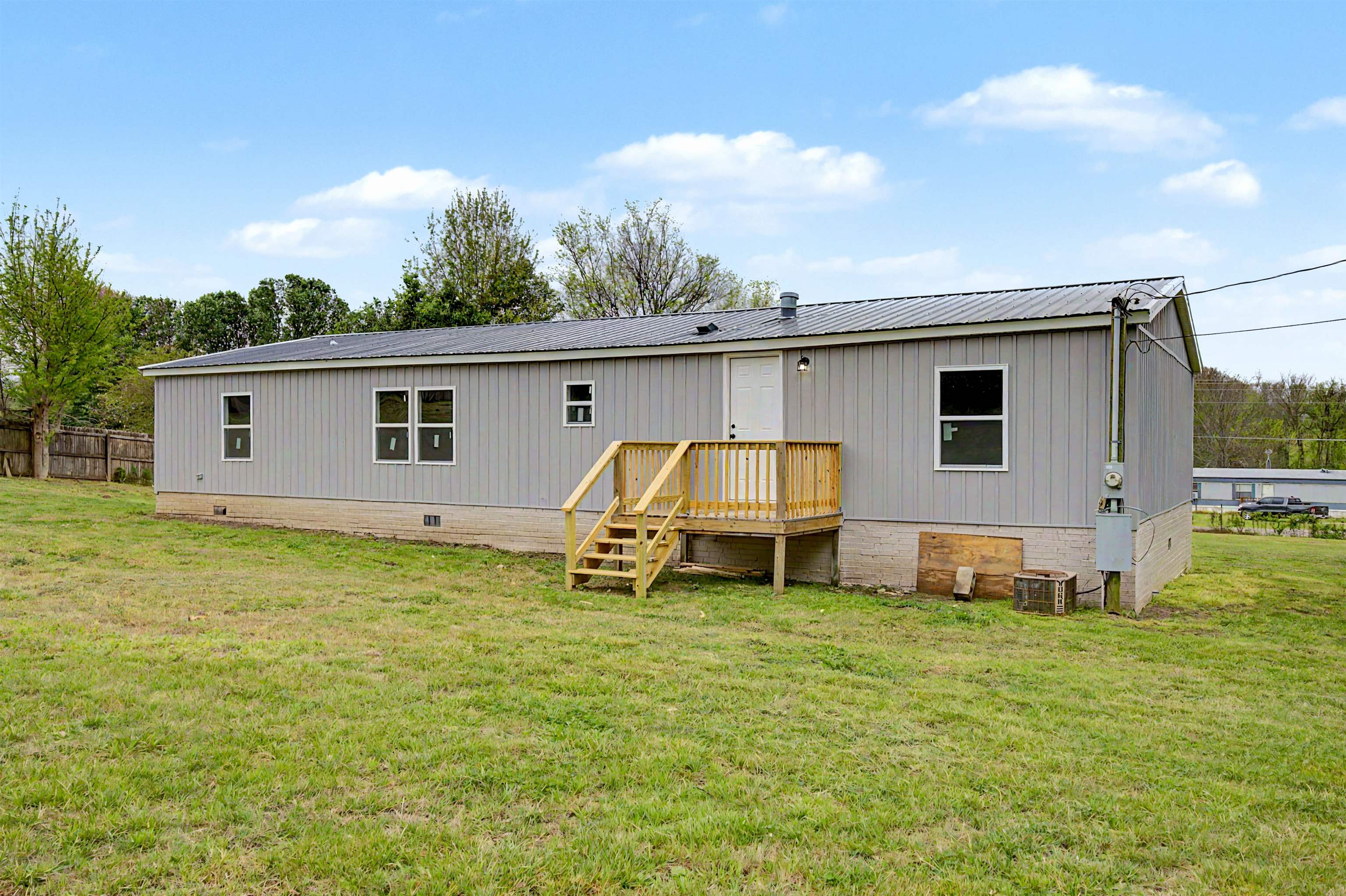 1090 Scott Road Newbern, TN 38059 - Photo 16 of 16 Back of property with crawl space and a wooden deck