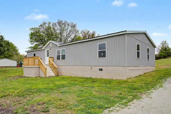a view of a backyard of the house