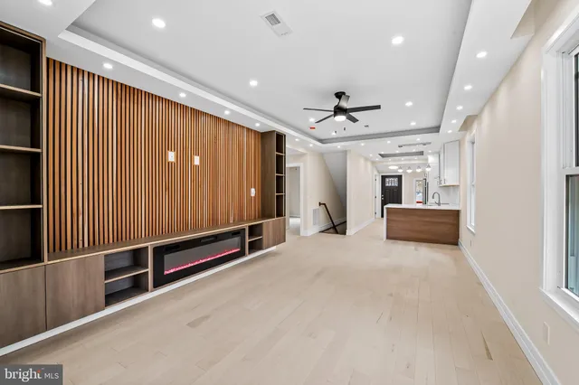 a view of a hall with a ceiling fan