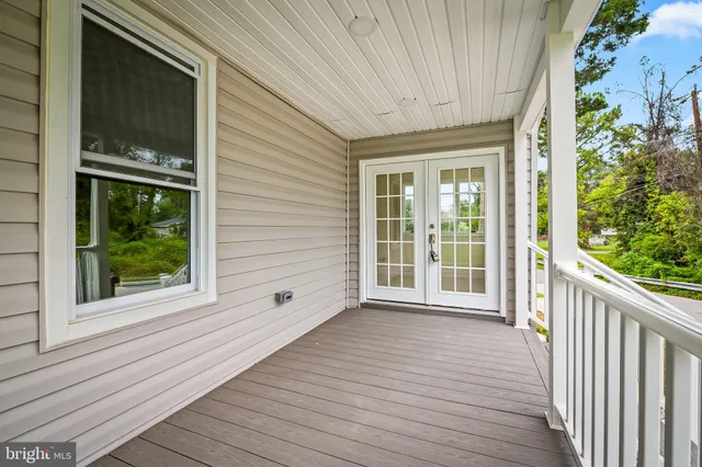 a view of a room with wooden floor and garden