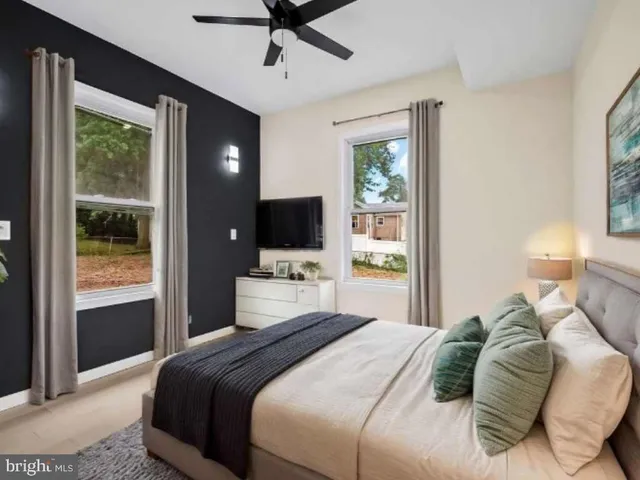 an empty room with windows and closet