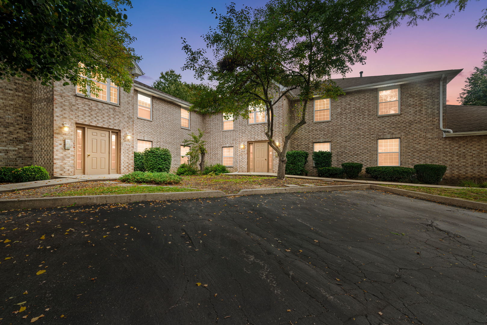 1940 Matthew Court, Unit D Elgin, IL 60123 - Photo 1 of 15 a front view of a house with a yard