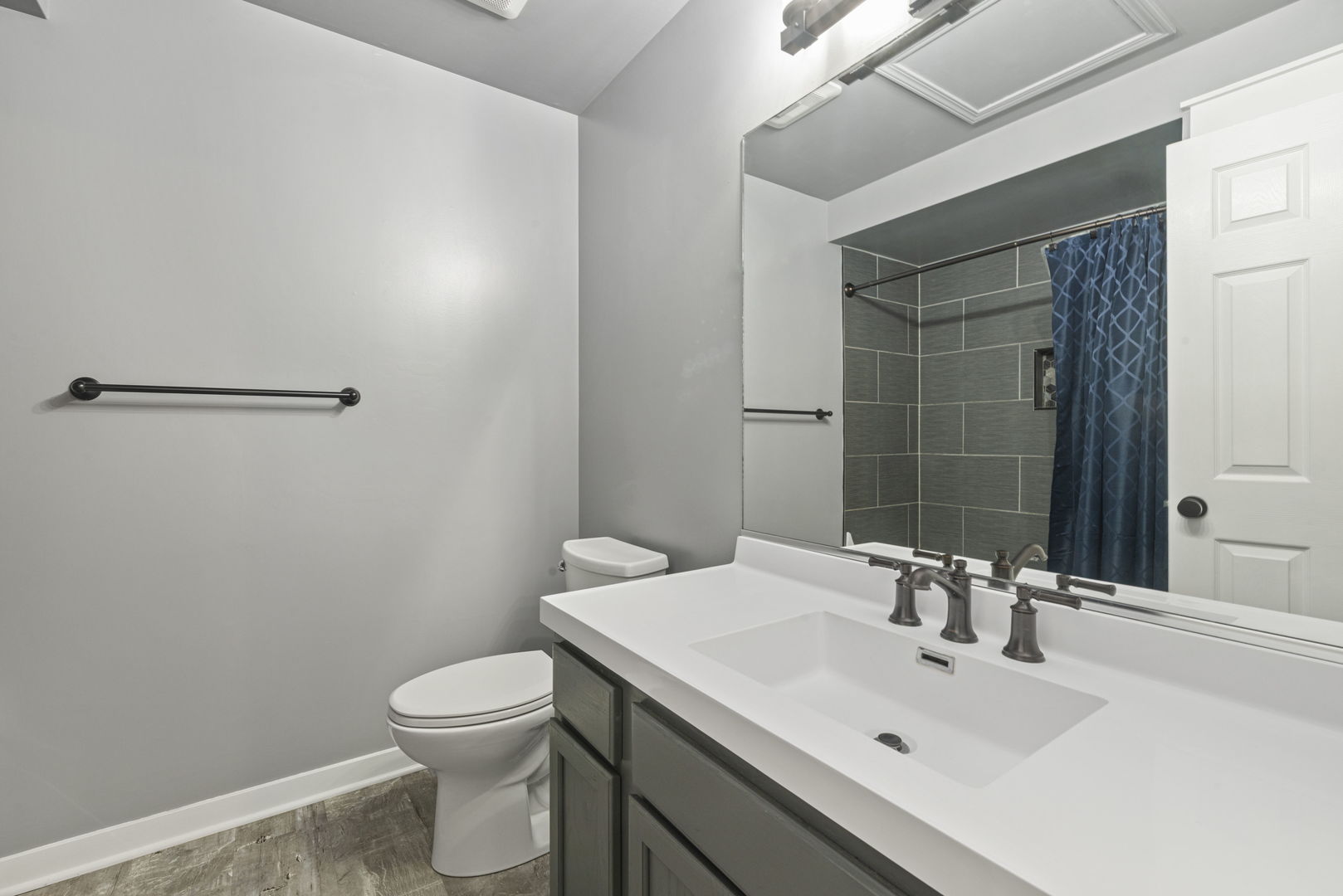 1940 Matthew Court, Unit D Elgin, IL 60123 - Photo 7 of 15 a bathroom with a sink a toilet and shower