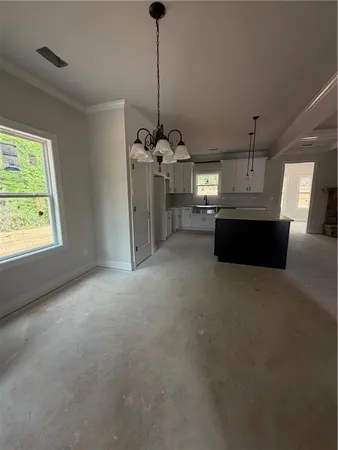 a view of a kitchen and a window