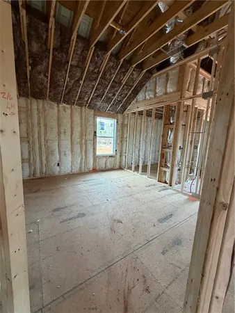 a view of a room with wooden walls
