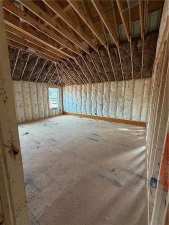 a view of a room with wooden walls