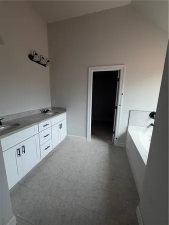 a view of a kitchen with cabinets