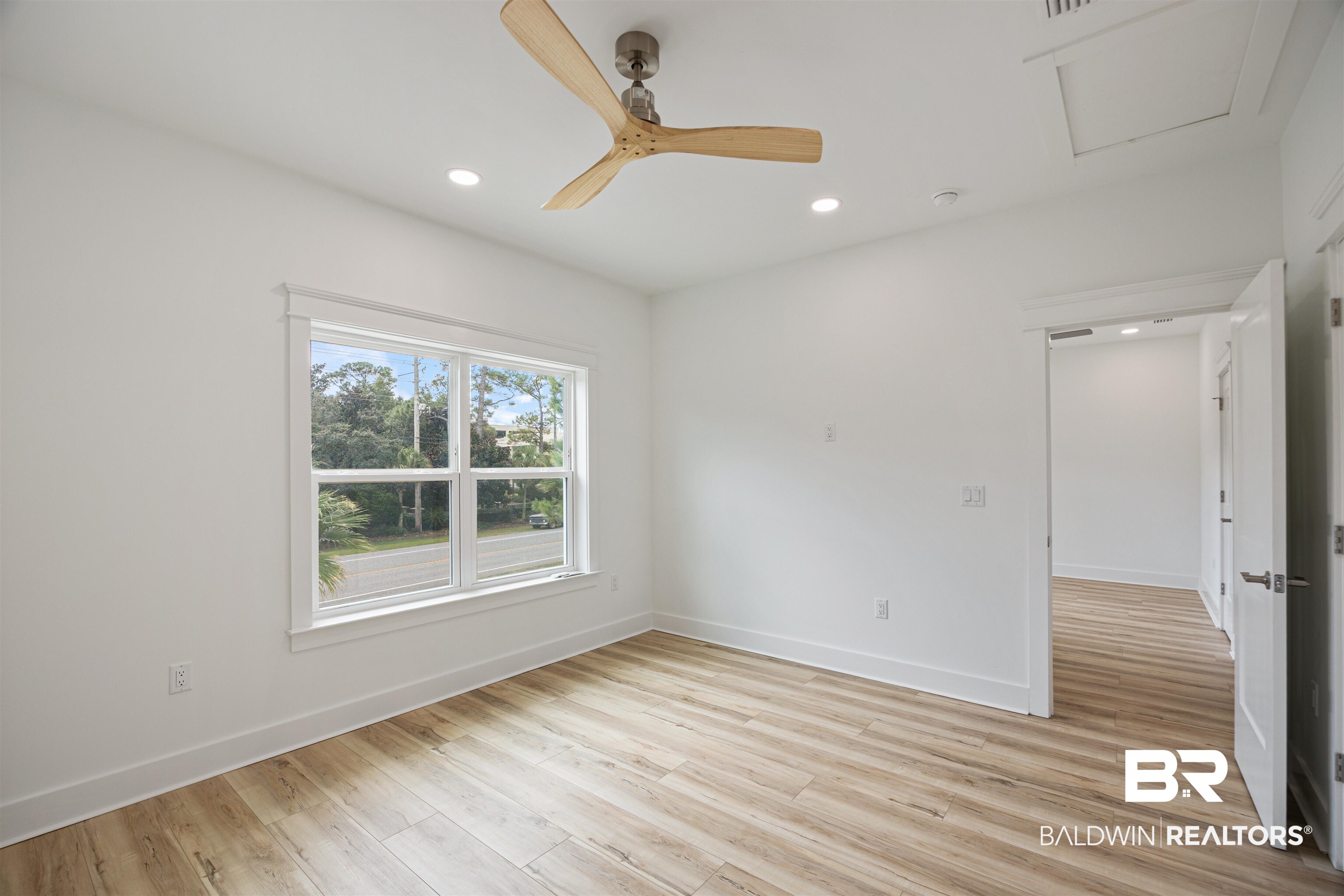 27591 Canal Road Orange Beach, AL 36561 - Photo 37 of 51 Empty room with light wood finished floors, ceiling fan, recessed lighting, and attic access