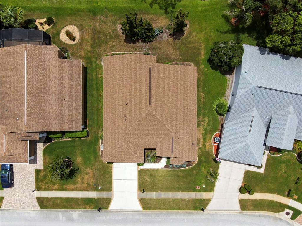 11228 Windrush Circle Hudson, FL 34667 - Photo 56 of 67 an aerial view of a house with garden space and street view