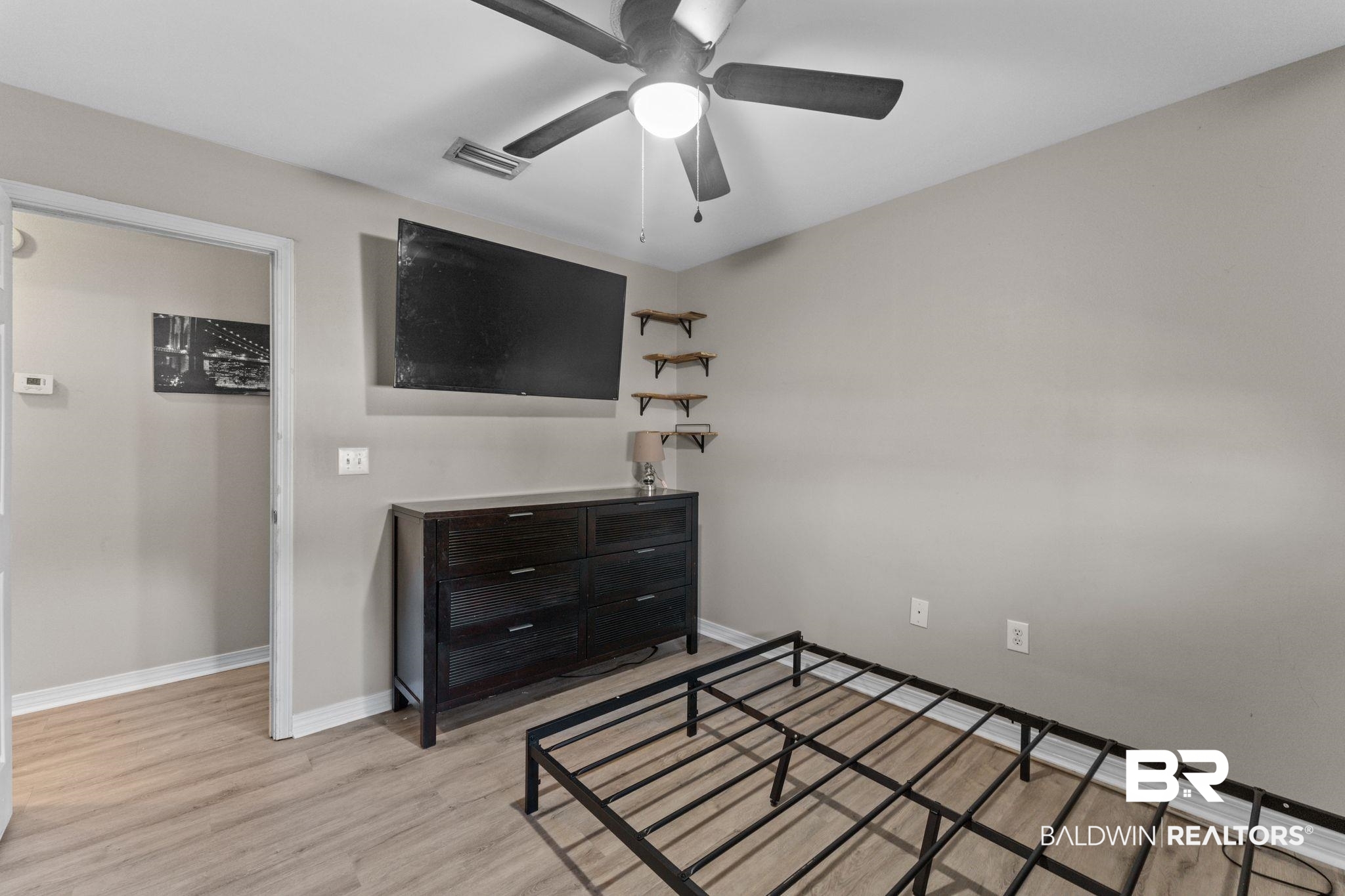 1549 Majesty Loop Foley, AL 36535 - Photo 15 of 25 Bedroom featuring light wood-style flooring and ceiling fan
