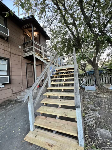 a view of entryway with wooden stairs