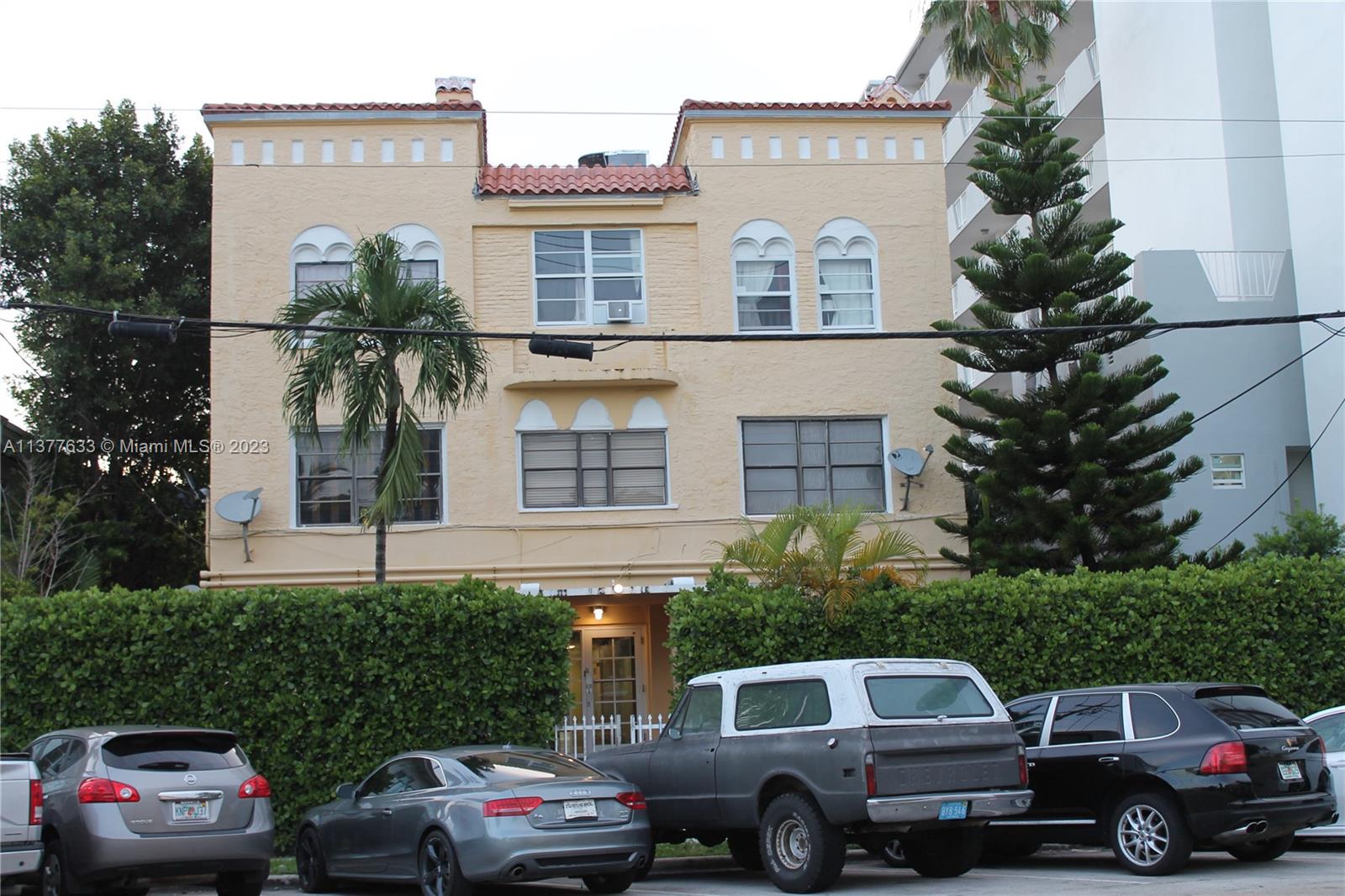 7149 Bay Drive, Unit 2 Miami Beach, FL 33141 - Photo 15 of 15 a front view of a house with cars parked